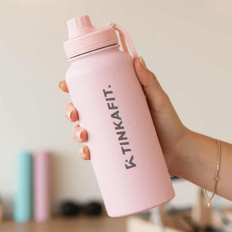 Pink GlowRise bottle in hand