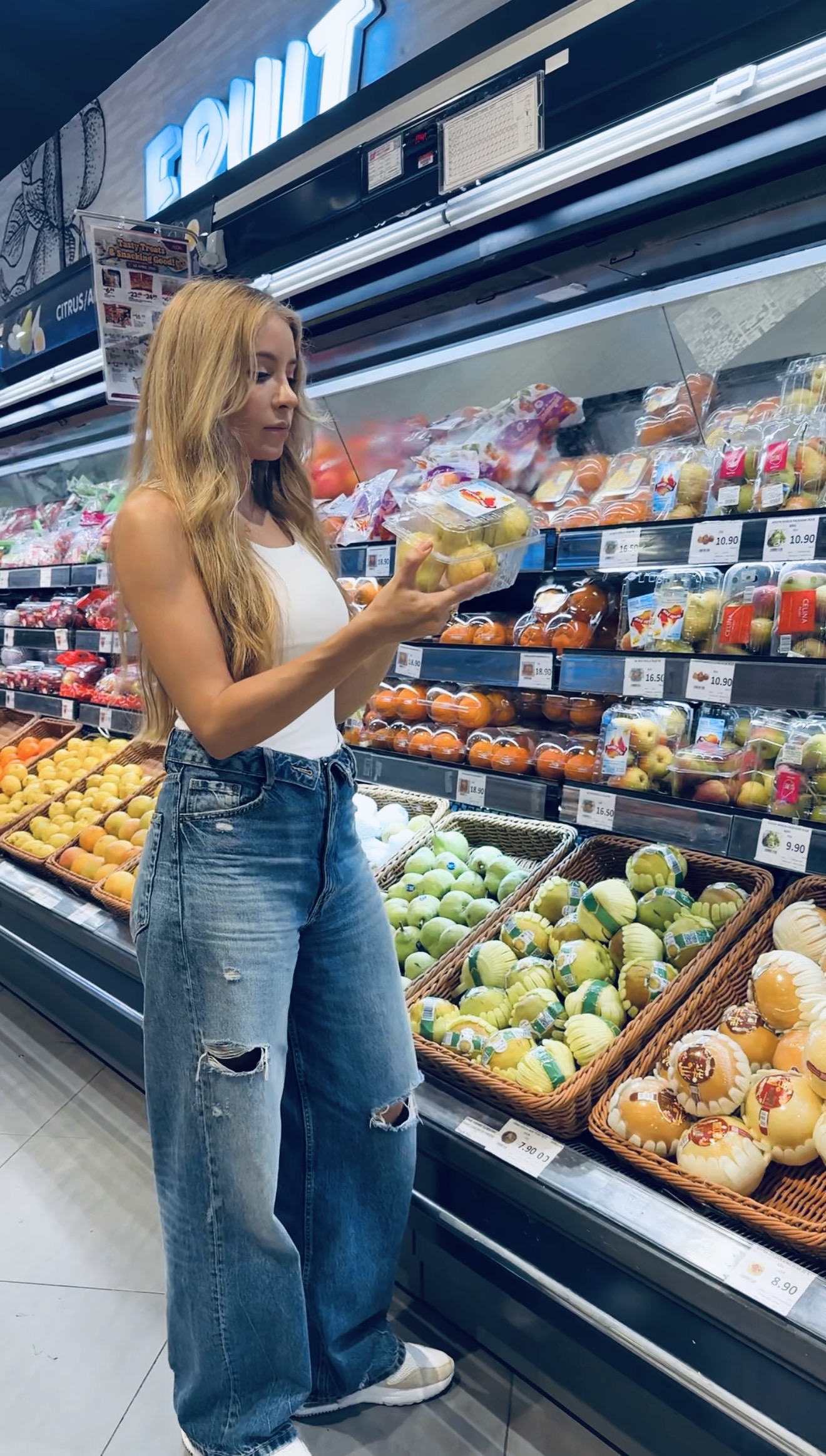 Tina selecting fresh fruit for sustainable healthy eating